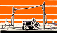 Tall posts carry fence wire over road.