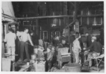 Lewis Hine child labor: Scene in Woodbury Bottle Works. They work nights. Location: Woodbury, New Jersey.