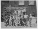 Lewis Hine child labor: Noon hour. These boys are all working in the Illinois Glass Co. 1) Smallest boy, Frank (?) Dwyer, 1009 1/2 E. 6 St., says he has been working here 3 months. 2) Joe Dwyer (brother) Has been working here over 2 years. 3) Henry Maul, 513 Central Ave. 4) Frank Schenk, Lives with uncle, 611 Central Ave. 5) Emil Ohley, 1012 E. 6th Street. 6) Wm. Jarett, 825 E. 5th Street. 7) Fred Metz, 707 Bloomfield Street. In addition to their telling me they worked I saw them beginning work just before 1 P.M. Photo at 12:30. Alton, Ill. May 17, 1910. Location: Alton, Illinois