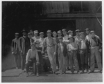 Lewis Hine child labor: Group of glass workers at Shop 7, Illinois Glass Co. 12:30 P.M. One of the smallest boys is Dennis White, 1013 Liberty St.,. Location: Alton, Illinois.