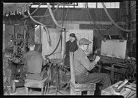 Lewis Hine: finishing door knobs Lewis Hine: finishing door knobs