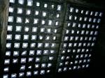 Looking up at vault lights from dark basement, Astoria, Oregon