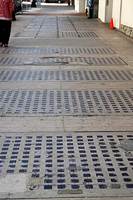 Long view down sidewalk in front of building, San Diego, California