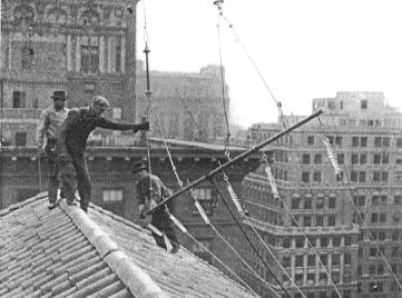 Installing Pyrex insulators at station WRNY, Hotel Roosevelt, New York City